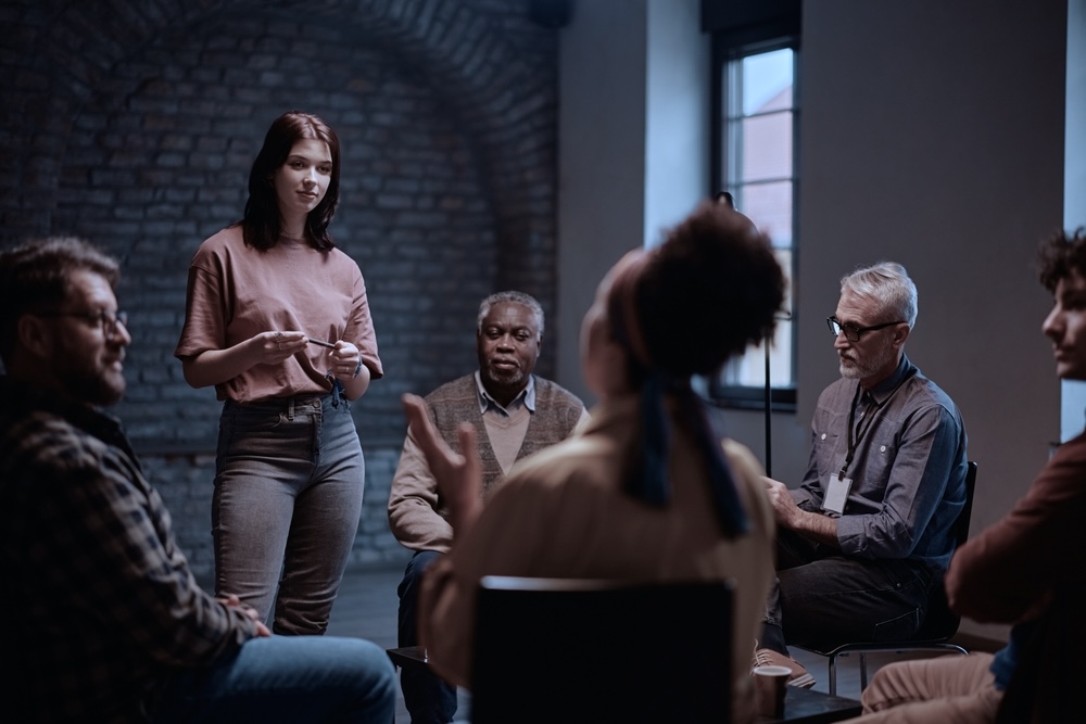 Woman experiencing benefits of inpatient rehab during group therapy