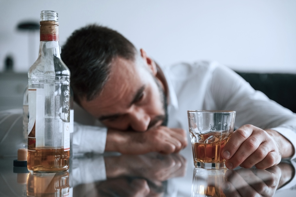 Adult male struggling with alcohol use disorder
